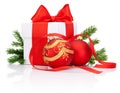 White gift box tied with Red ribbon, decorations Christmas ball and fir tree branch Isolated Royalty Free Stock Photo