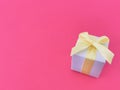 White gift box on a magenta background, copy space. Royalty Free Stock Photo