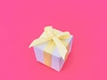 White gift box on magenta background. Royalty Free Stock Photo