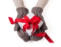 White gift box in wool gloves