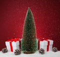 White gift boxes and fir tree on red background.