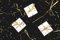 White gift boxes with gold ribbon on shine background.