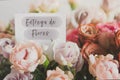 White gift card with the inscription flower delivery in spanish in a bouquet of bright beautiful multi-colored roses, Royalty Free Stock Photo