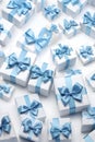 White gift group with blue ribbons on white background.