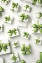 White gift group with green ribbons on white abstract background.
