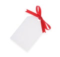 White gift tag with red bow Royalty Free Stock Photo