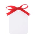 White gift tag with red bow Royalty Free Stock Photo