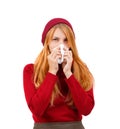 A white girl in red wipes her nose on a white isolated background Royalty Free Stock Photo
