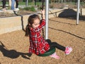 White girl riding zip line in the park Royalty Free Stock Photo