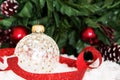 White glass Christmas baubles in snow. Holiday Theme