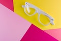 White glasses on a color background, top view. Trendy minimal style with colorful paper backdrop Royalty Free Stock Photo