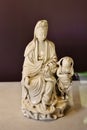 White glazed child worshoipping Avalokitesvara