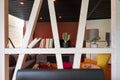 white glazed wooden beams, half-timbered optics as modern room dividers with books