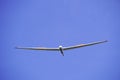 White glider with blue cloudless sky Royalty Free Stock Photo