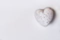 White Glitter Heart on a Textured White Background Royalty Free Stock Photo