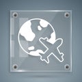 White Globe with flying plane icon isolated on grey background. Airplane fly around the planet earth. Aircraft world Royalty Free Stock Photo