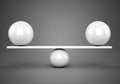 White glossy balls balanced on plank Royalty Free Stock Photo