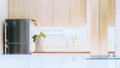White glossy counter top and blur kitchen room background