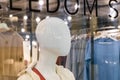 White glossy mannequin. Faceless girl. Fashion and style concept. Demonstration of fashionable clothes and accessories. Plastic