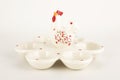 White glossy porcelain 6 eggs holder on the white background Royalty Free Stock Photo