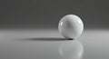White glossy sphere on reflective gray surface Royalty Free Stock Photo