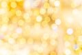 Gold bokeh background. Abstract glitter festive blur lights. Soft yellow christmas backdrop. Royalty Free Stock Photo