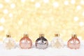 White and gold Christmas ornaments in snow Royalty Free Stock Photo