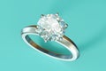 White blue engagement diamond ring on tiffany blue background