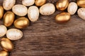 White and gold Easter egg corner border over rustic wood Royalty Free Stock Photo