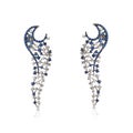 White gold openwork earrings with white diamonds and blue sapphires Royalty Free Stock Photo