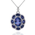 White gold pendant with blue sapphires and white diamonds Royalty Free Stock Photo