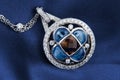 White Gold Pendant With  Diamonds, Blue And Smokey Topaz Royalty Free Stock Photo