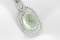 White Gold Pendant With Green Amethyst And Diamonds On Soft Whit Royalty Free Stock Photo