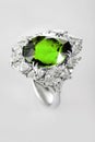 White gold or silver ring with green emerald Royalty Free Stock Photo