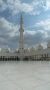 White and golden Minarete of the Sheikh Zayed Mosque in the blue sky Royalty Free Stock Photo