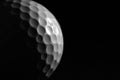 White golf ball on black background. Royalty Free Stock Photo