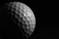 White golf ball on black background. Royalty Free Stock Photo