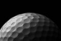 White golf ball on black background. Royalty Free Stock Photo