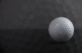 White golf ball on black background copy space Royalty Free Stock Photo