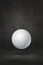 White golf ball on a black studio background Royalty Free Stock Photo