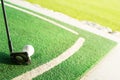 White golf ball and golf club on a driving range Royalty Free Stock Photo