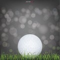 White golf ball in green grass field and light blurred bokeh background. Vector Royalty Free Stock Photo