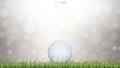 White golf ball in green grass field and light blurred bokeh background. Royalty Free Stock Photo