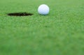 White golf ball on putting green Royalty Free Stock Photo