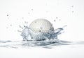White golf ball splashing into water, forming a crown splash. Royalty Free Stock Photo