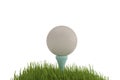 A white golf ball on tee in grass isolated on white background. Royalty Free Stock Photo