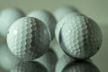 White golf balls reflecting on a plate of glass Royalty Free Stock Photo