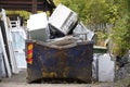 White goods in skip for disposal at dump site