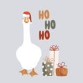 White goose in Santa Claus helper hat, gift boxes, and ho-ho-ho lettering isolated design element. Funny and cute goose Royalty Free Stock Photo