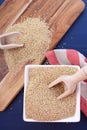 White grain quinoa on blue wood background.